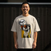 Man wearing a beige t-shirt featuring a ferret wearing sunglasses and a "Pop!" speech bubble.