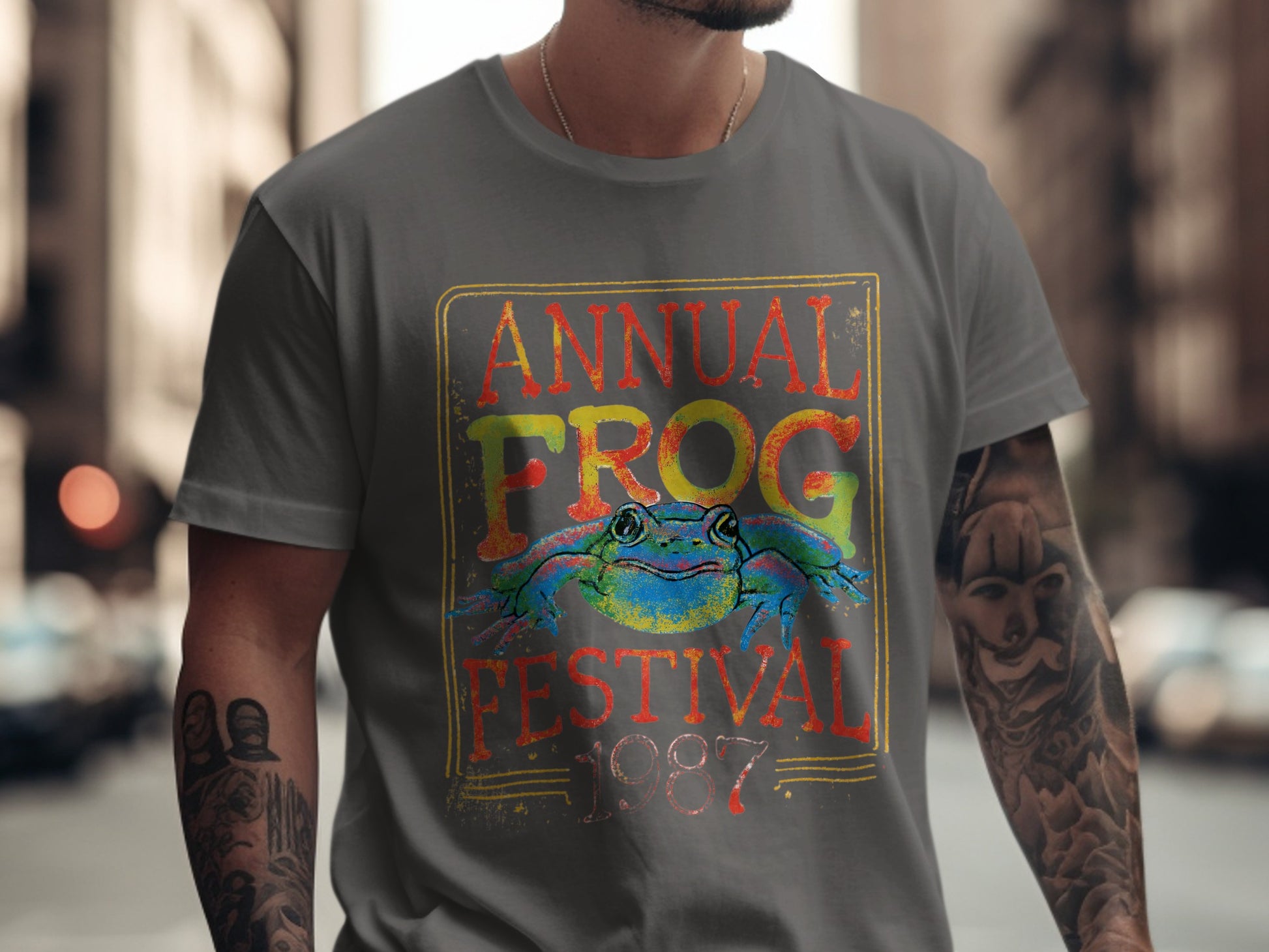 Annual Frog Festival 1987 graphic on a gray t-shirt.