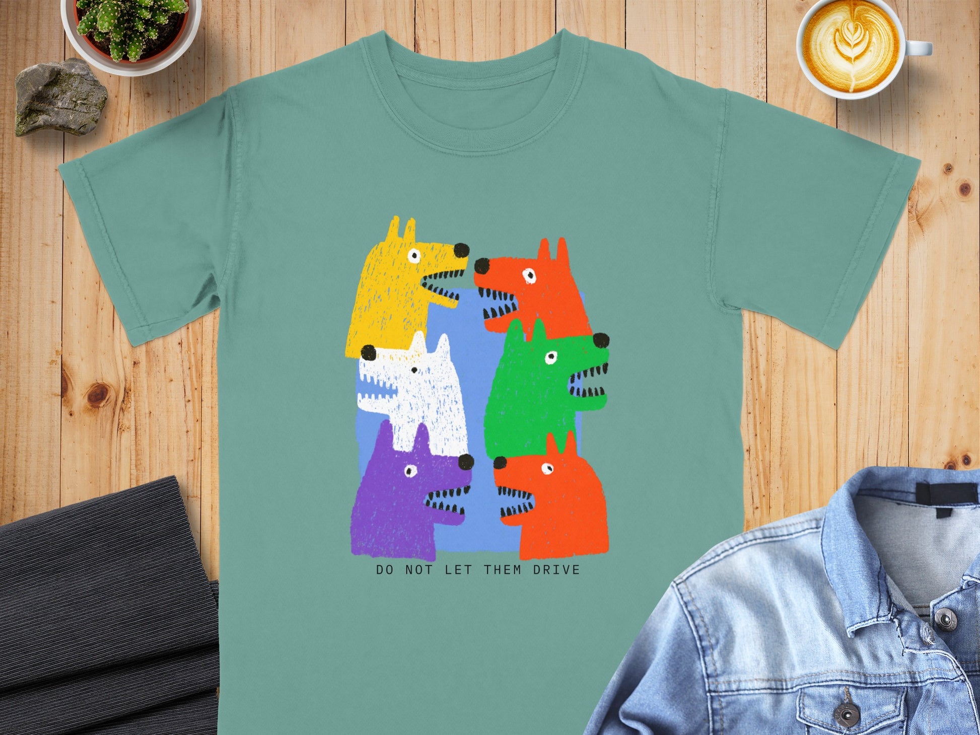 T-shirt with six colorful cartoon dogs and text "DO NOT LET THEM DRIVE".