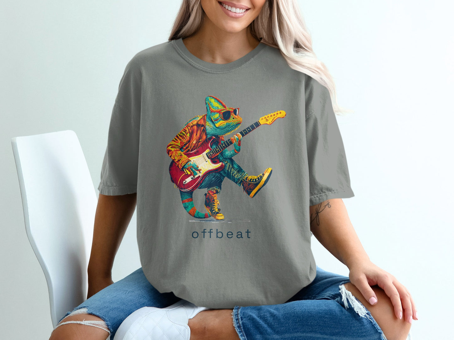 Colorful chameleon playing guitar wearing sunglasses, "offbeat" text.