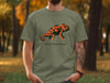 Green t-shirt with "Social Camouflage" text and a stylized orange chameleon graphic.