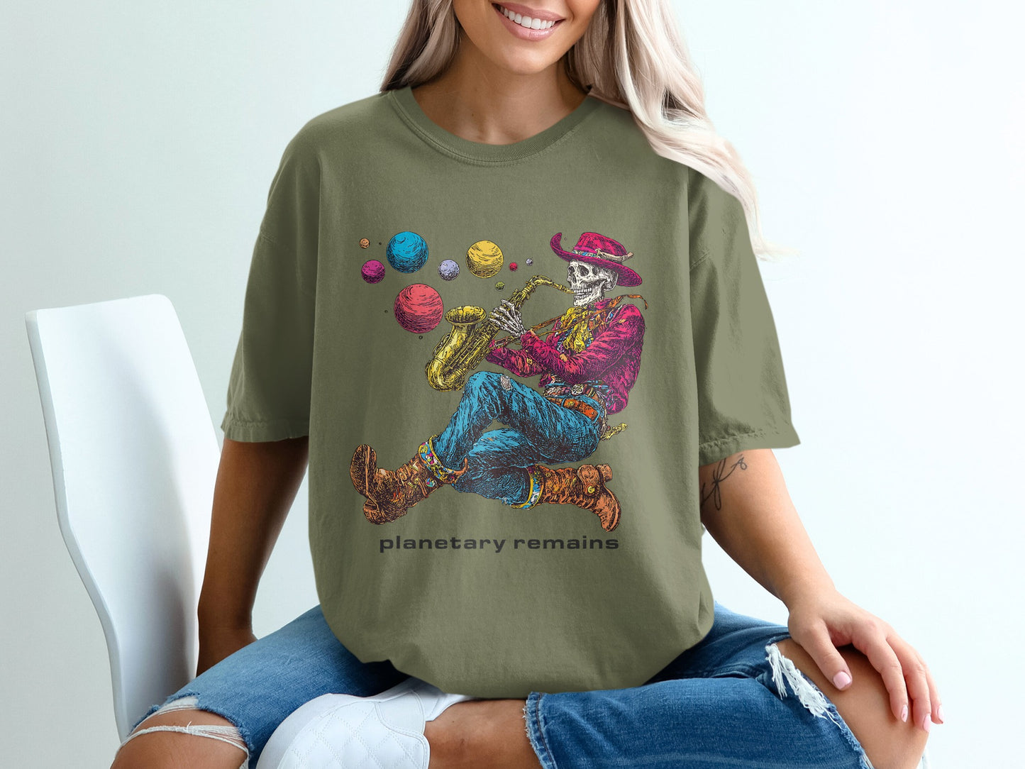 Skeleton in cowboy hat playing saxophone, with colorful planets floating.
