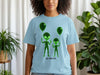 Light blue t-shirt with green wireframe aliens holding balloons.