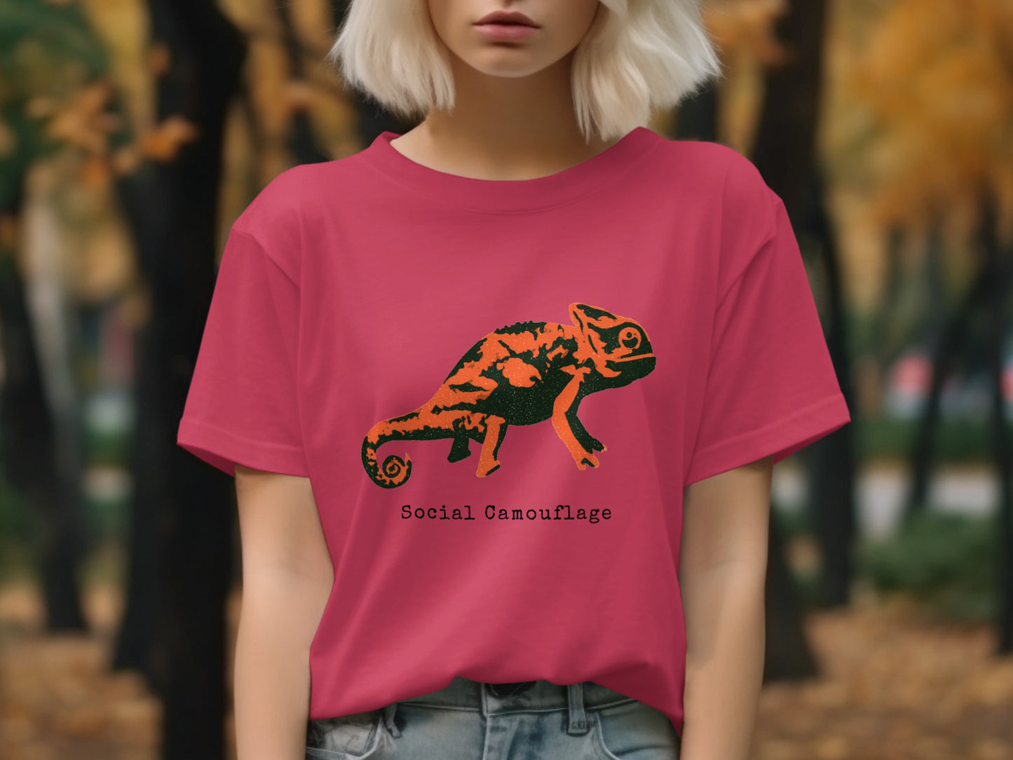 Pink t-shirt with orange chameleon graphic and "Social Camouflage" text.