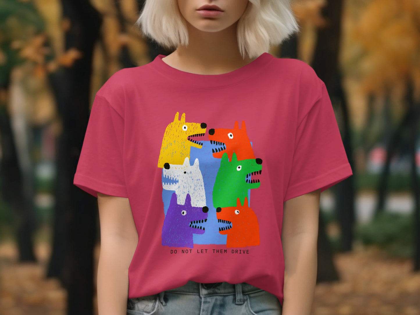 Pink t-shirt with colorful cartoon dogs and "DO NOT LET THEM DRIVE" text.