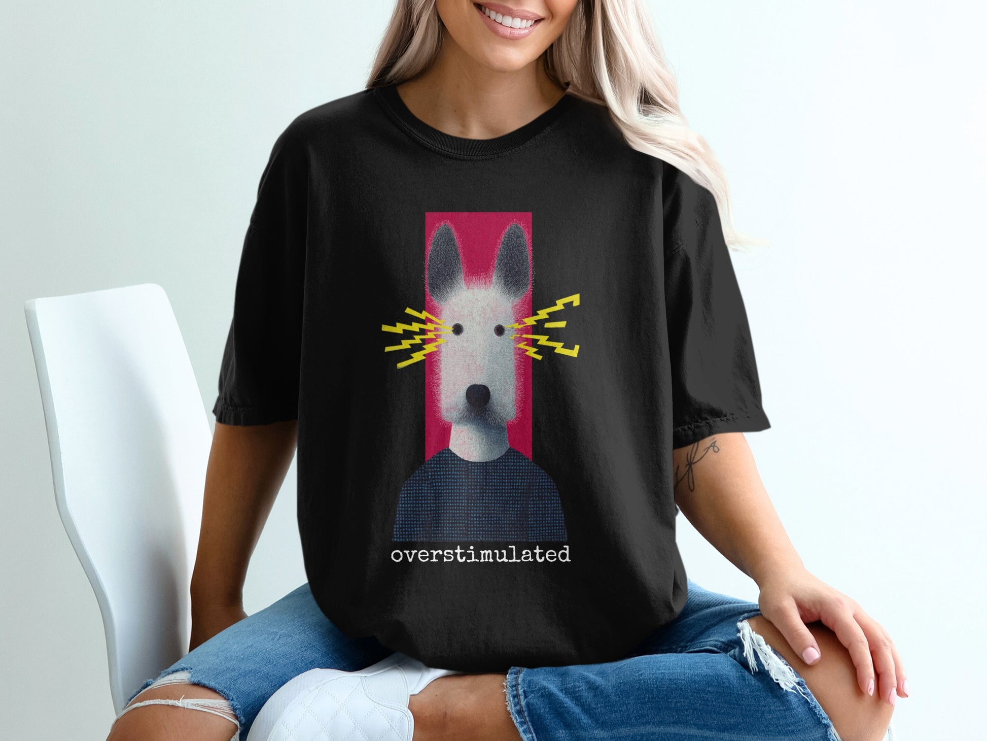 Black t-shirt with a graphic of a dog wearing a blue shirt and yellow lightning bolts.