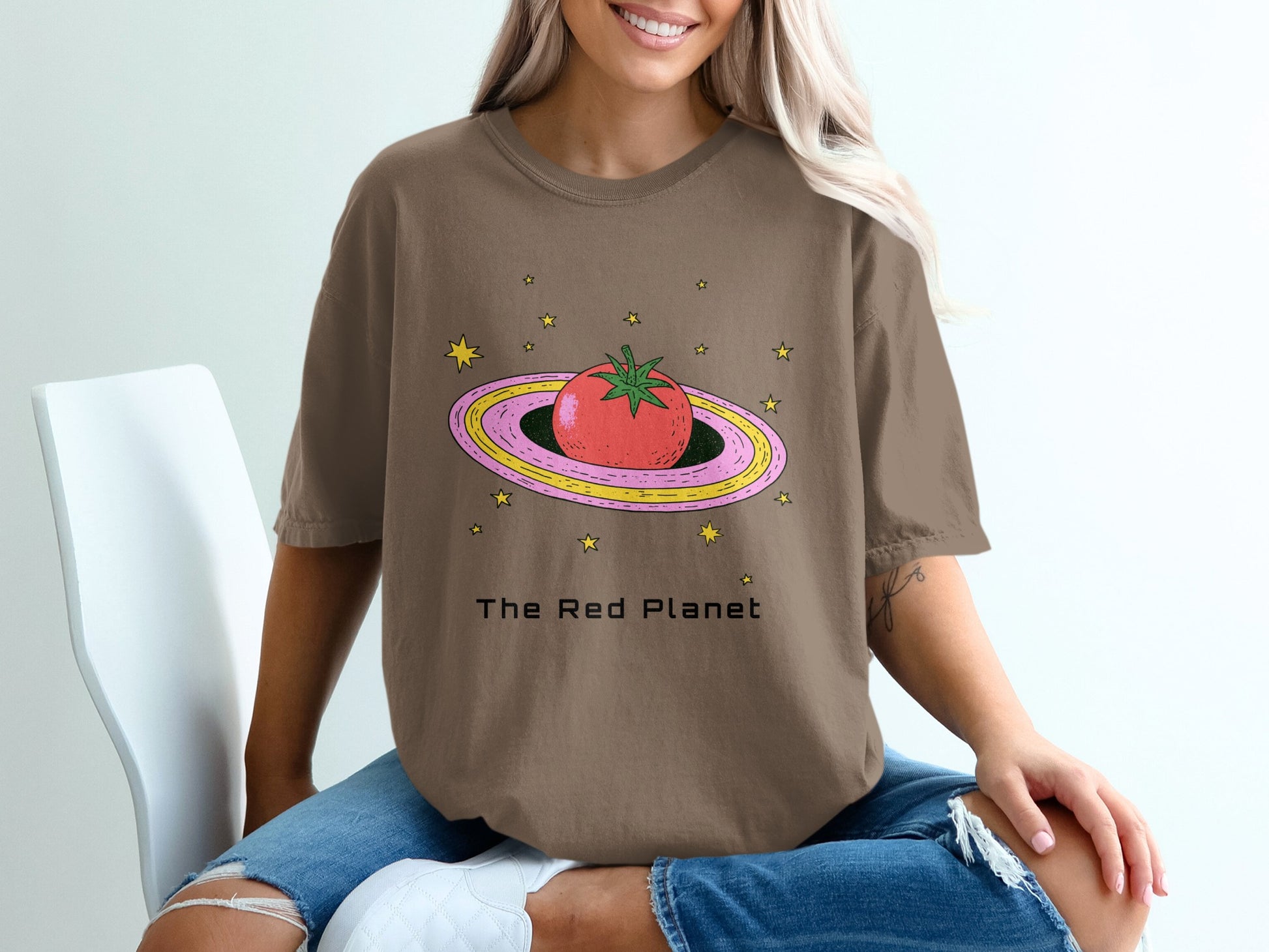 Brown t-shirt with a cartoon tomato ringed like Saturn, reading "The Red Planet".