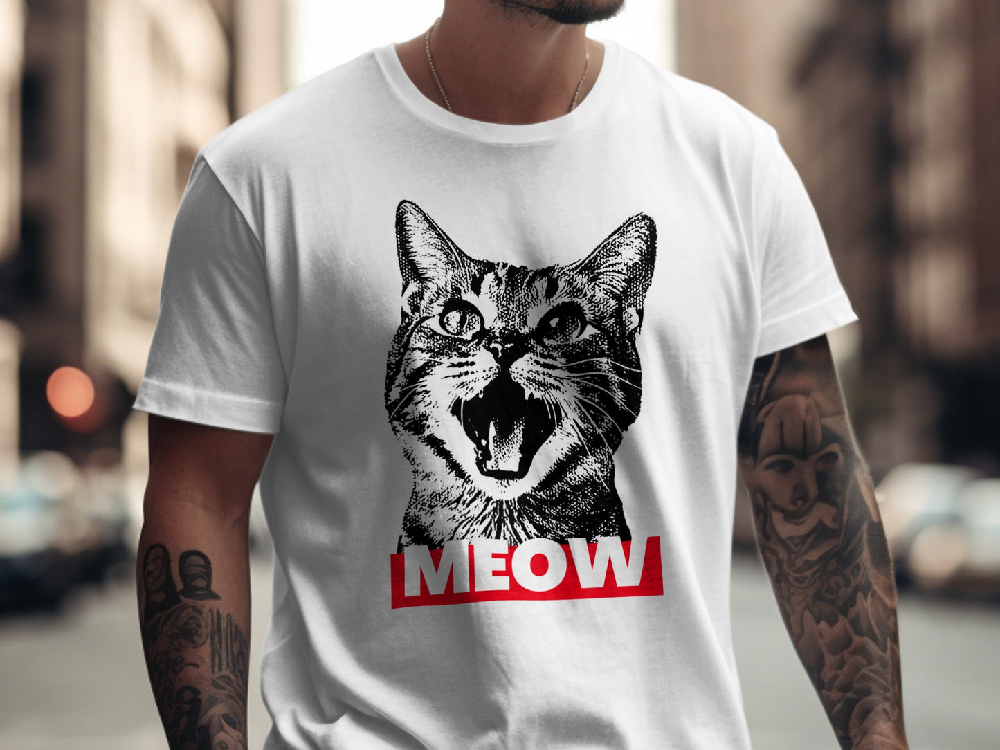 Black and white cat with open mouth on white t-shirt, with "MEOW" in red.