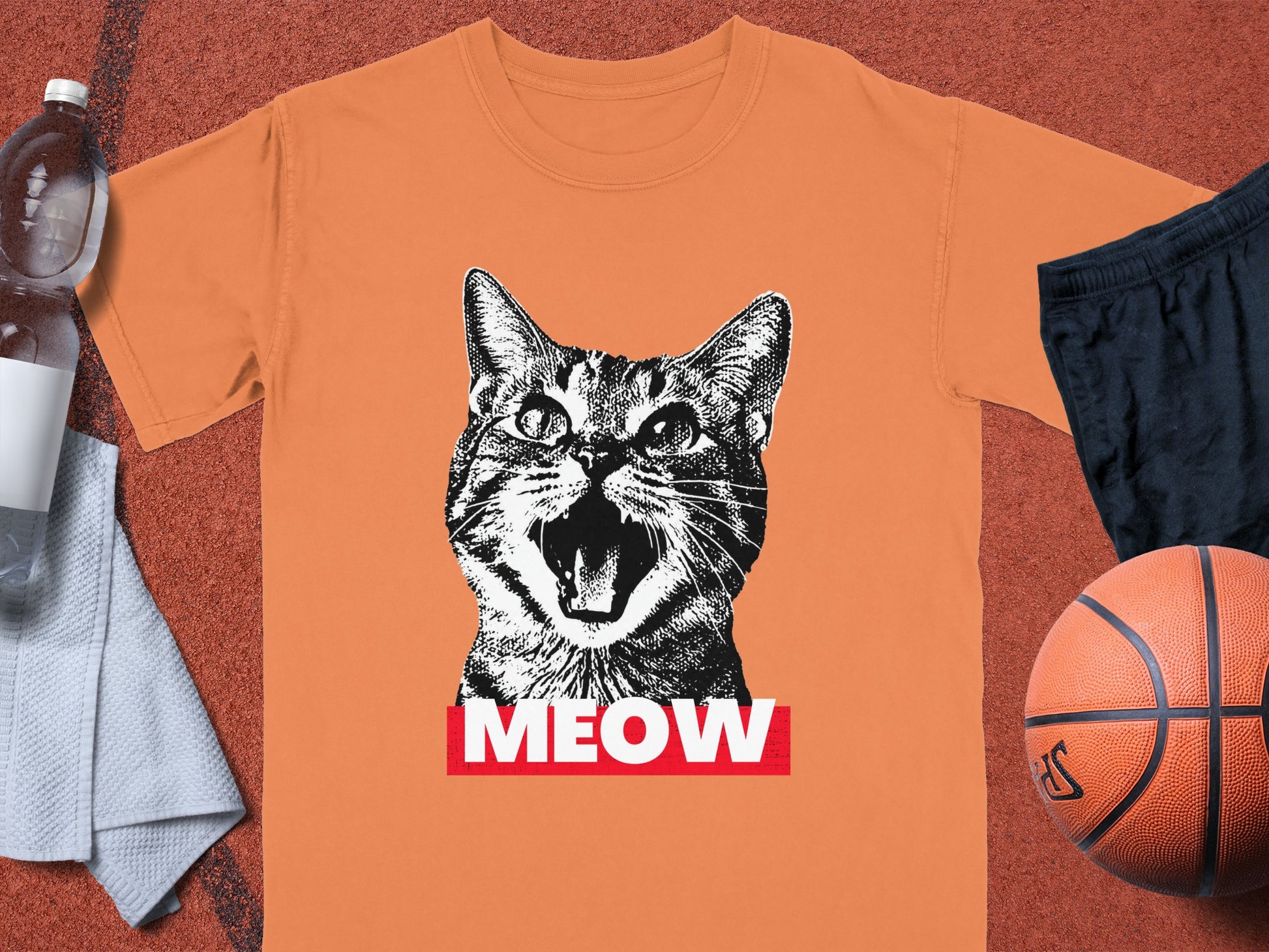 Orange t-shirt with a distressed black and white cat face graphic and "MEOW" text.
