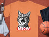 Orange t-shirt with a distressed black and white cat face graphic and "MEOW" text.