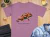 Purple t-shirt with a green and orange chameleon and "Social Camouflage" text.
