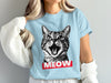 Light blue t-shirt featuring a black and white distressed graphic of a cat's open mouth with "MEOW" in red.