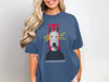 Dark blue t-shirt with "overstimulated" text and a dog with lightning eyes.