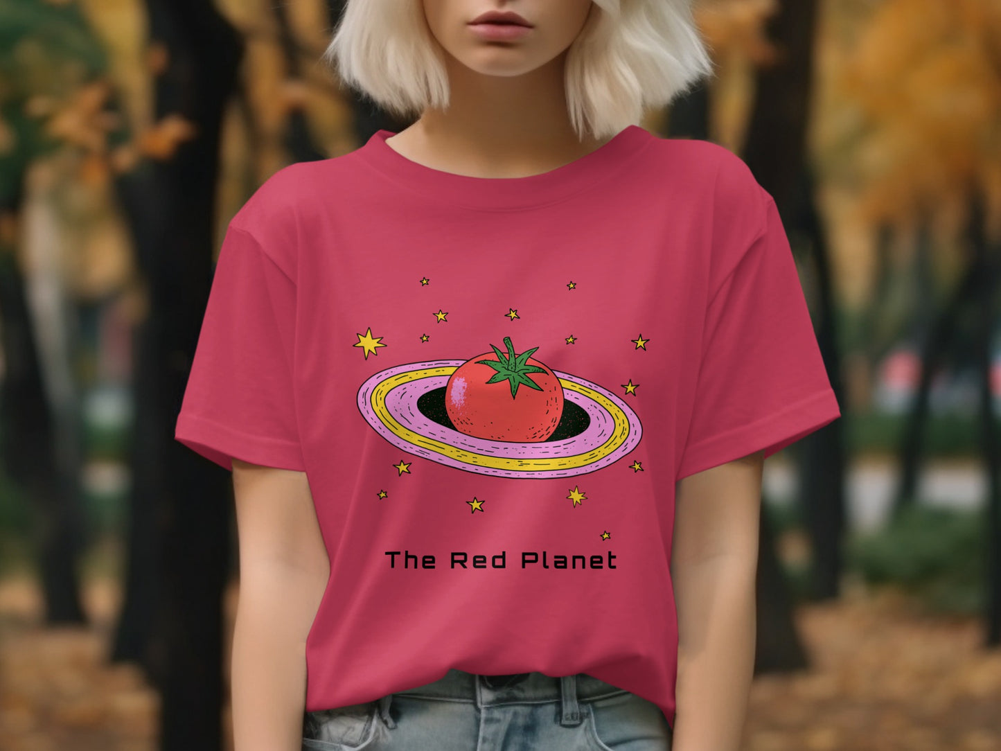 Red t-shirt with a cartoon tomato on a planet, surrounded by stars.