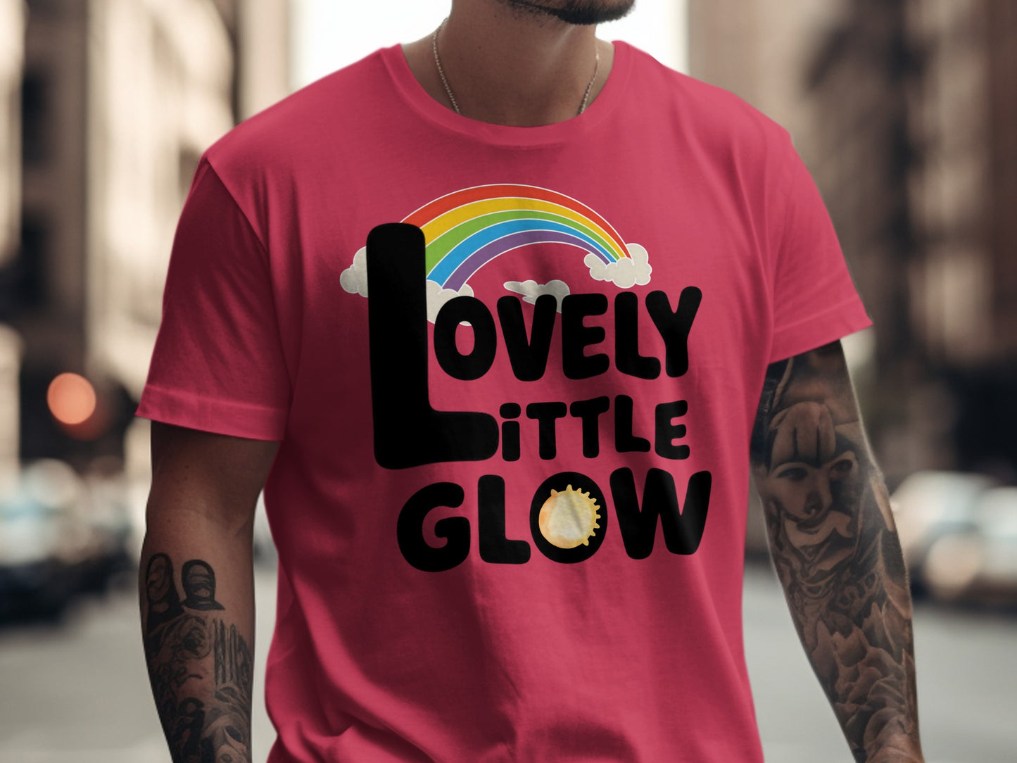 Pink t-shirt with "LOVELY LITTLE GLOW" text and rainbow graphic.