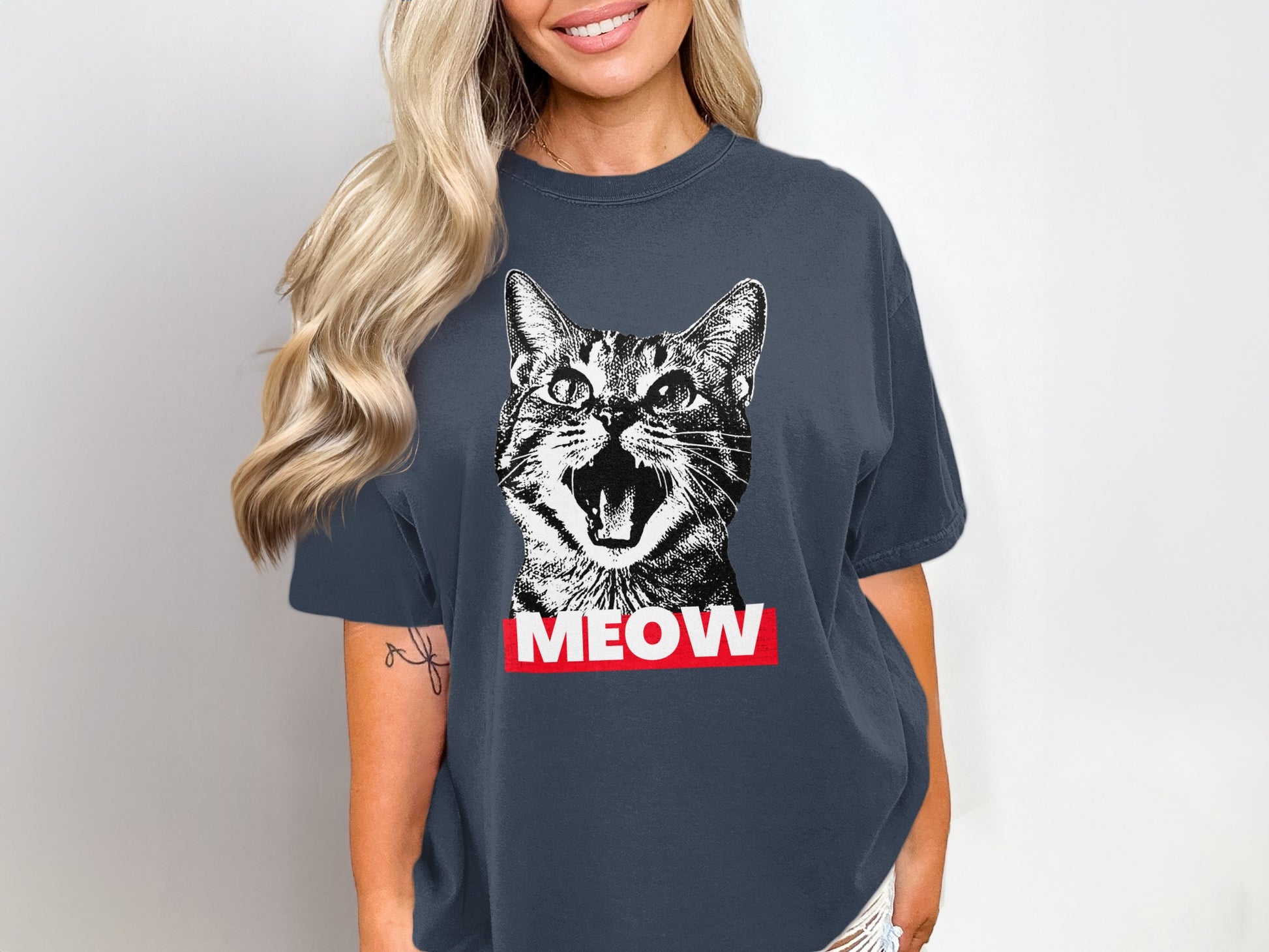Dark gray t-shirt with a black and white cat face and "MEOW" text.